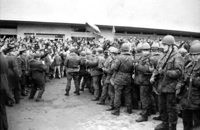 Singing Lithuanian civilian defenders flash victory signs at Soviet soldiers preparing to occupy the Vilnius Press Center, January 11, 1991. Photo by Paulius Lileikis. Courtesy of the Central State Archives of Lithuania, LCVA 0-1-8094. Photo Credit: The Power of Song: Nonviolent National Culture in the Baltic Singing Revolution (Seattle and Copenhagen: University of Washington Press and Museum Tusculanum Press, 2014), p. 301.